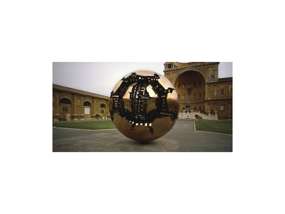 Arnaldo Pomodoro's bronze sphere sculpture in the Cortile della Pigna, its outer shell broken to show machinery inside.