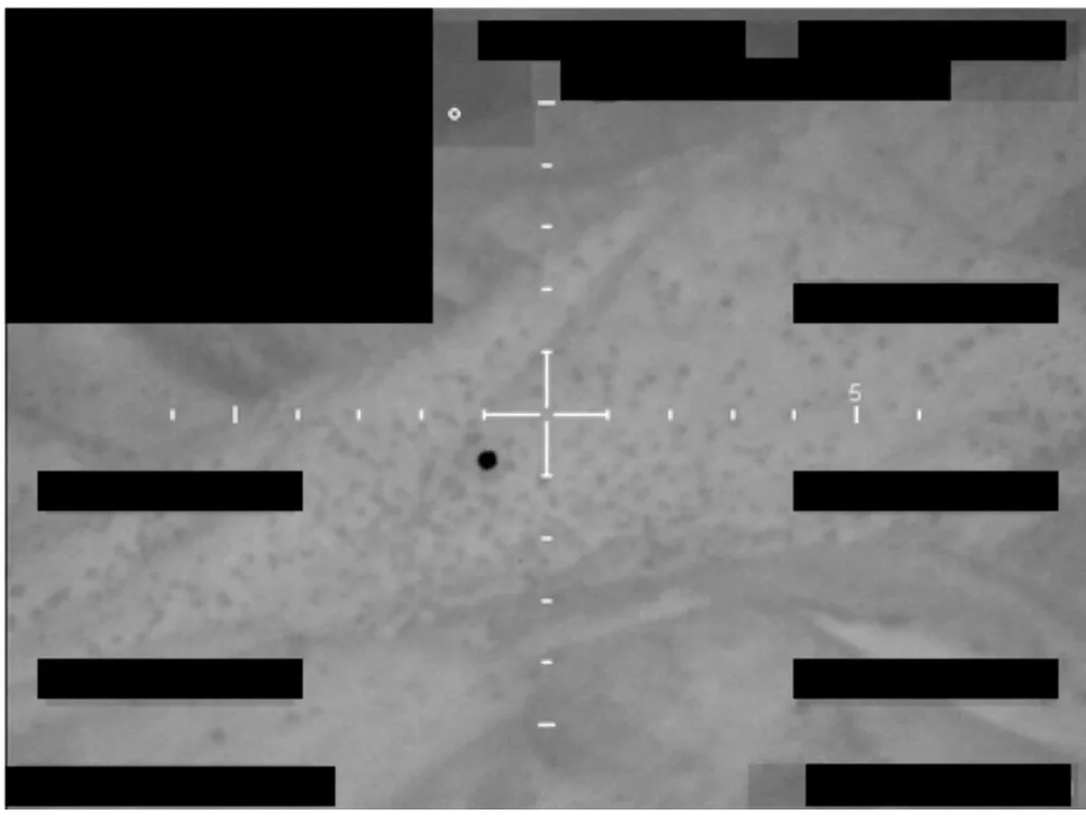 Sensor frame with a crosshair at the centre and redaction bars covering the telemetry.